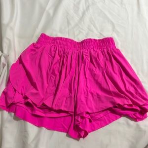 neon pink flowy shorts with pocket